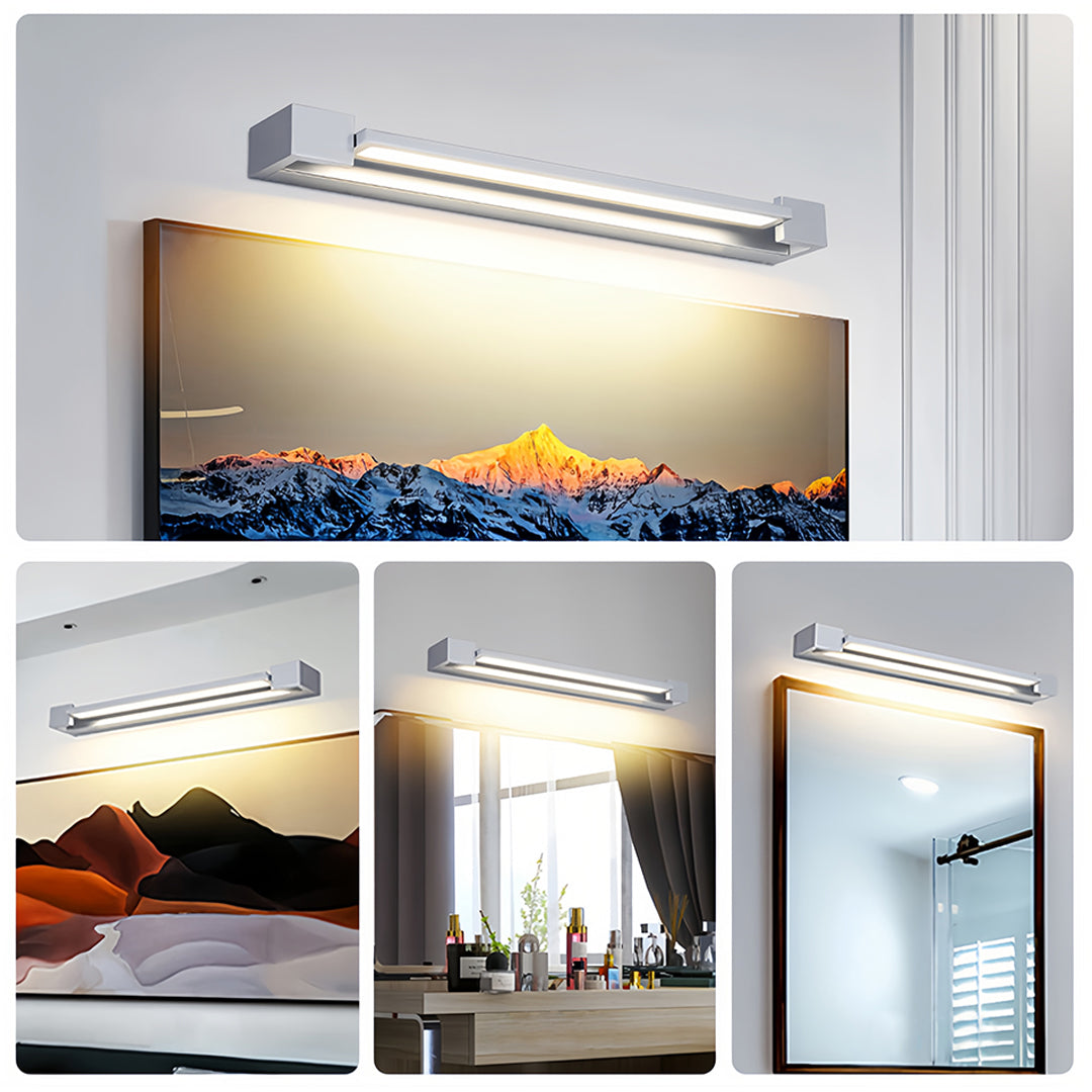 Contemporary chrome bathroom vanity light installed above artwork providing accent illumination