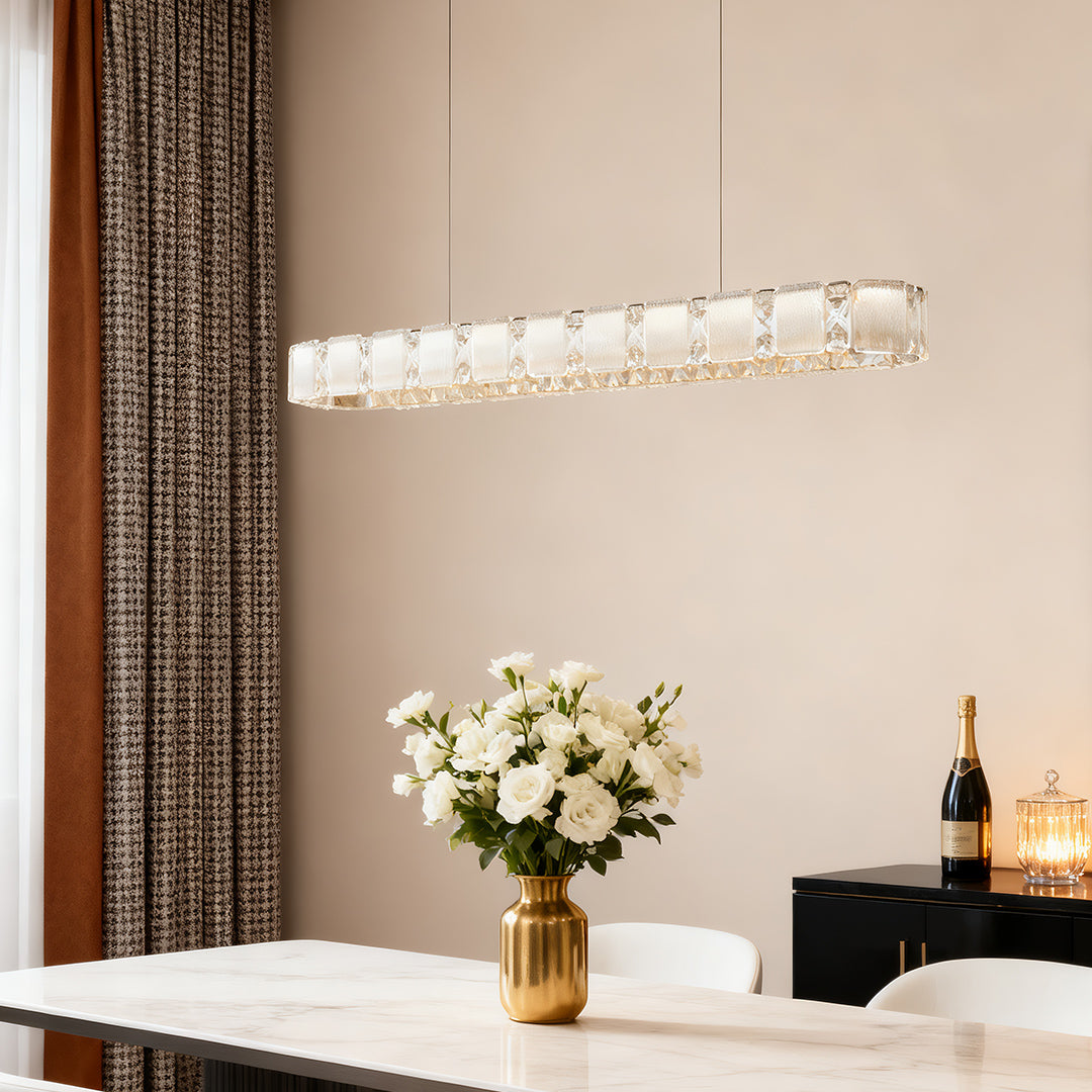 Contemporary chrome chandelier providing elegant focal point lighting above modern dining table