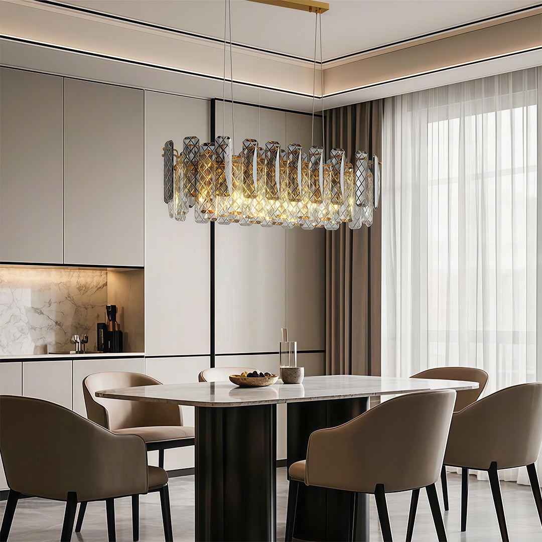 Contemporary crystal chandeliers providing ambient light in modern dining area with black chairs.