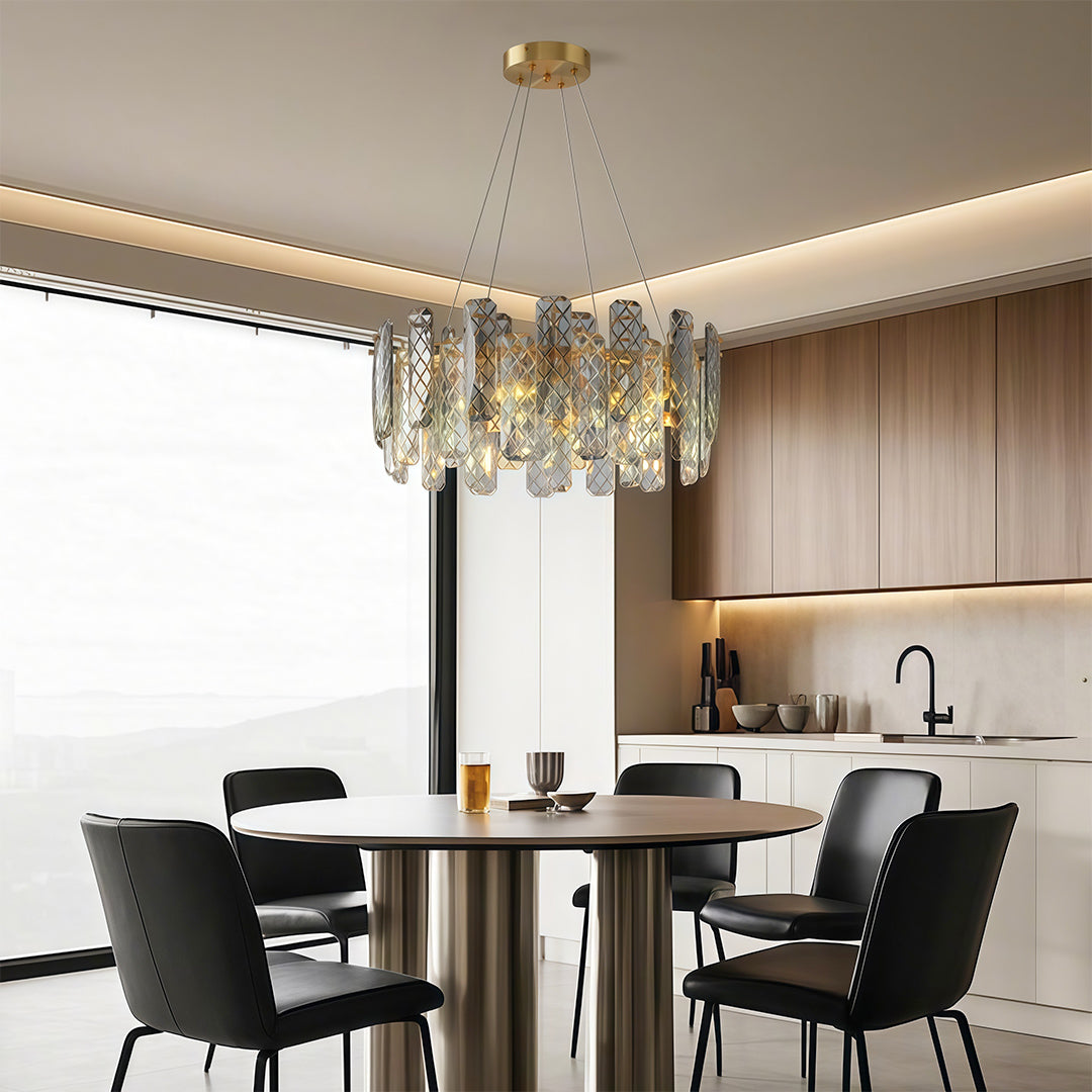 Contemporary crystal chandeliers creating dramatic effect in bright dining room with recessed ceiling.