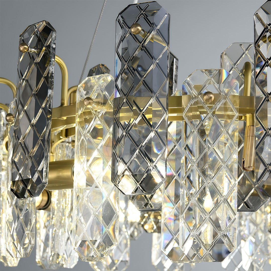Contemporary crystal chandeliers lighting open-concept dining and living space with artwork.