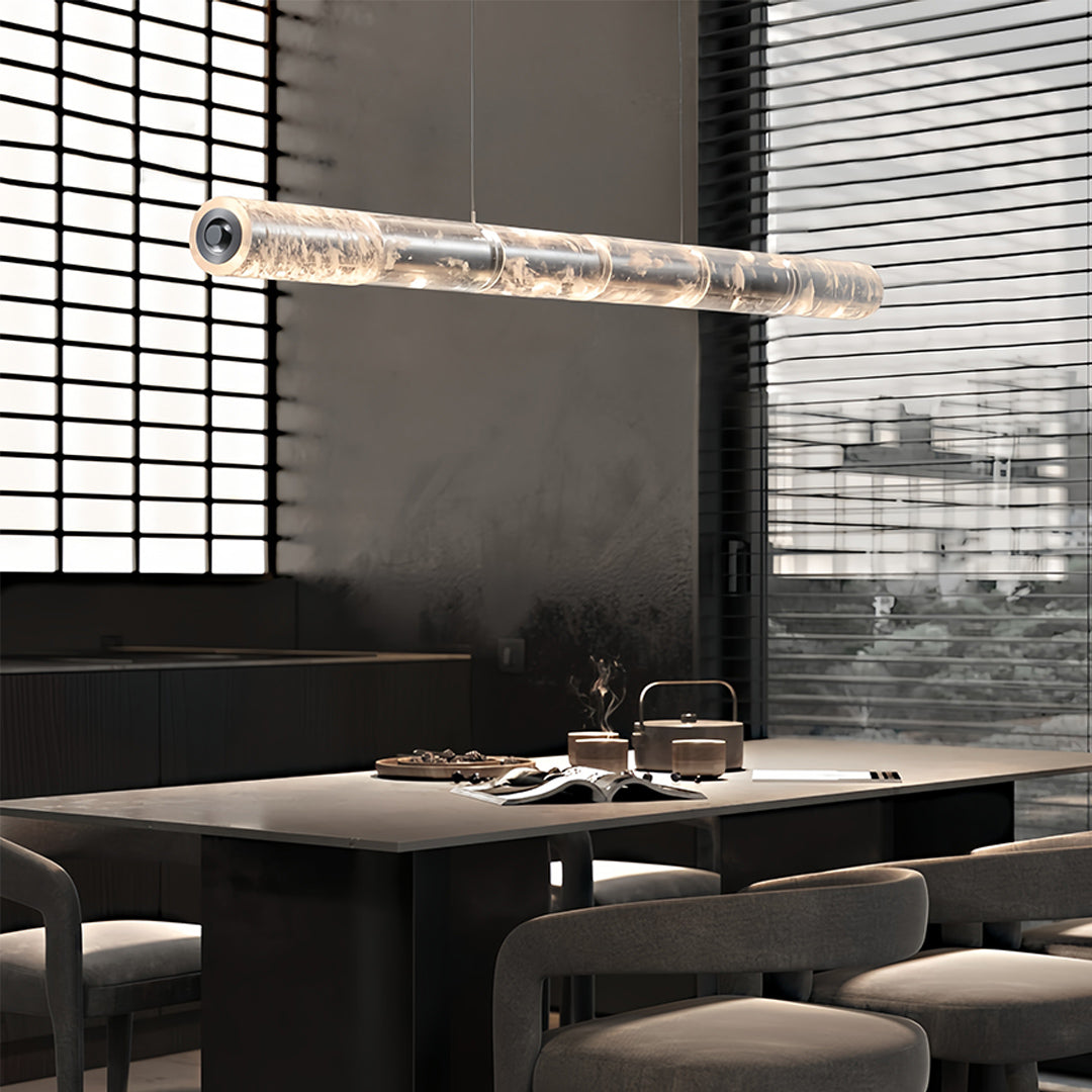 Contemporary crystal light pendants with a unique crystal texture, suspended in a modern interior space.