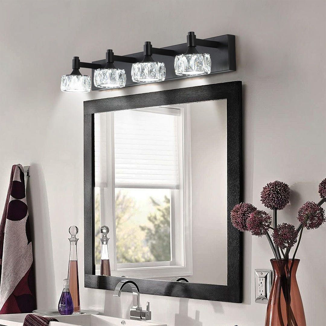 Contemporary crystal bathroom vanity light featuring glass shade chandelier aesthetic above black-framed mirror with decorative accents.