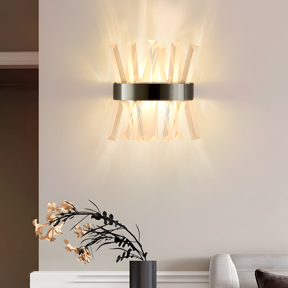 Contemporary crystal wall sconces with a close-up of the crystal and gold details.