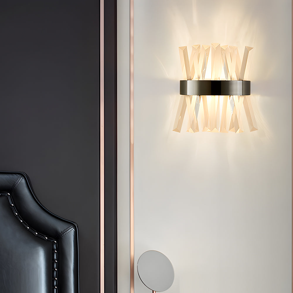 Contemporary crystal wall sconces casting a gentle glow in a minimalist living room.