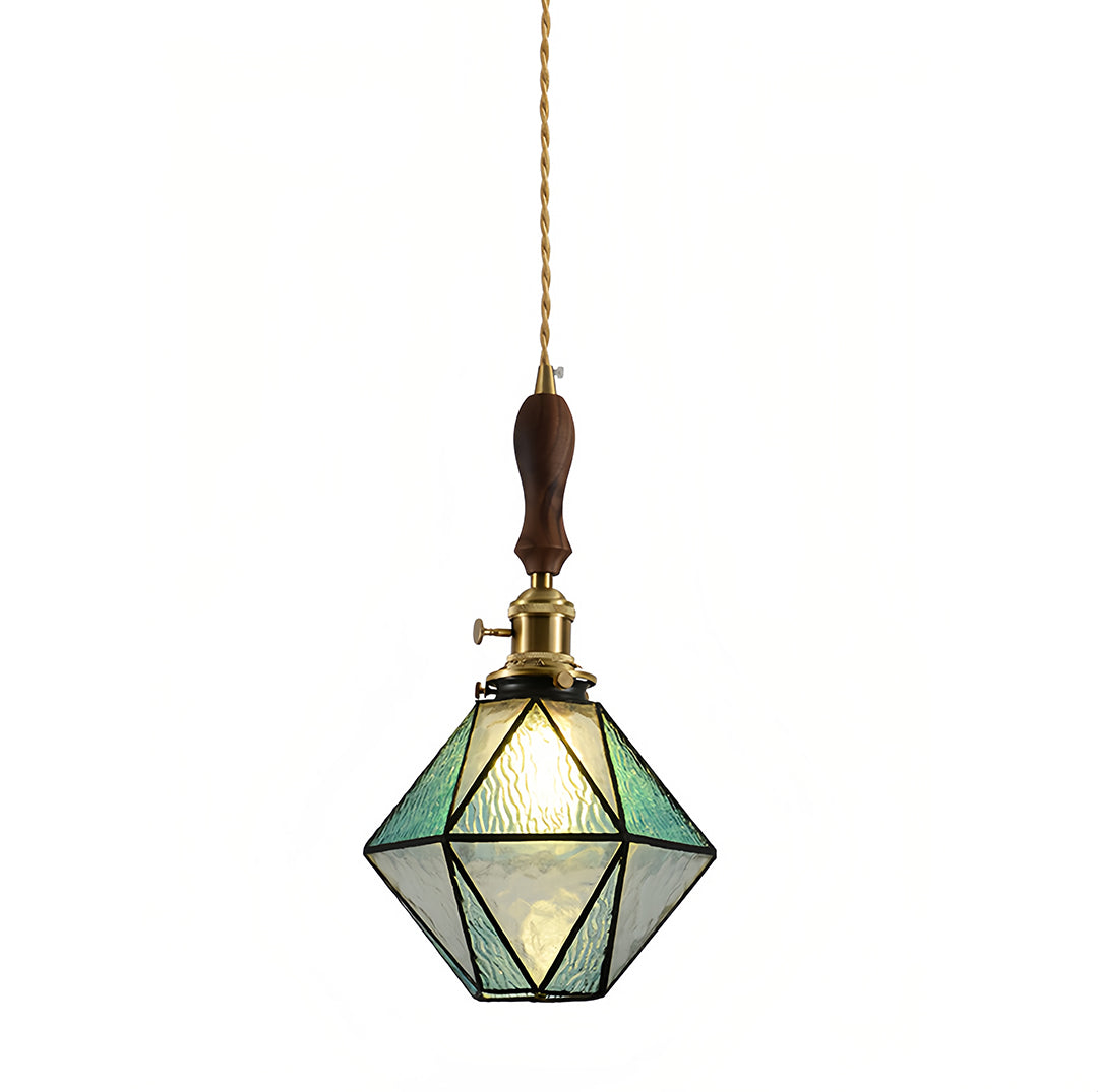 Contemporary diamond-shaped pendant light with teal glass and brass frame creating stunning geometric focal point