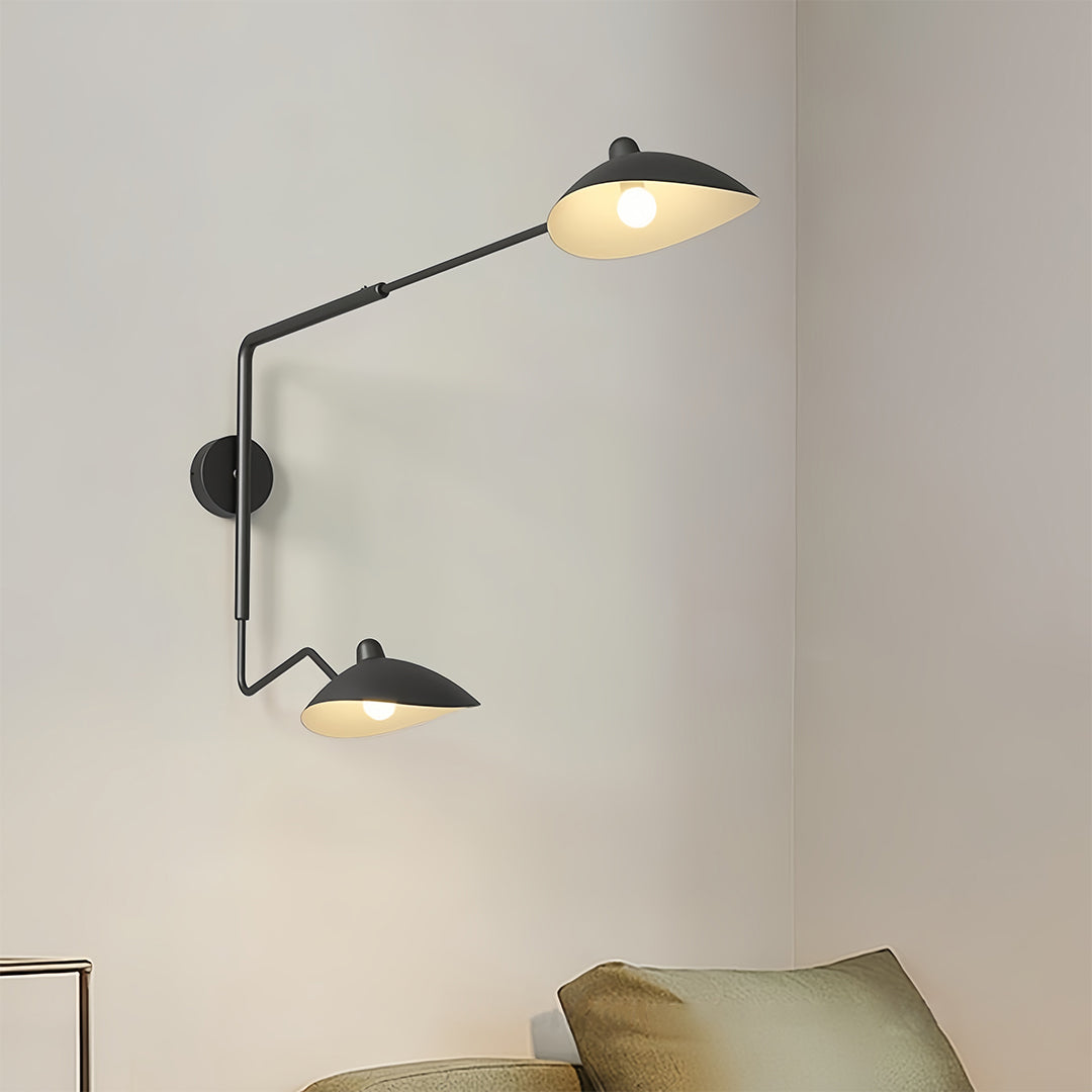 Contemporary double swing arm wall light featuring a black arm and a wood accent on the metal shade, shown in an isolated product view.