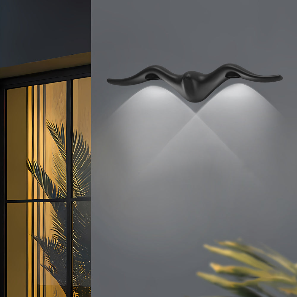 Contemporary two light outdoor wall sconce illuminating modern building facade with warm accent lighting