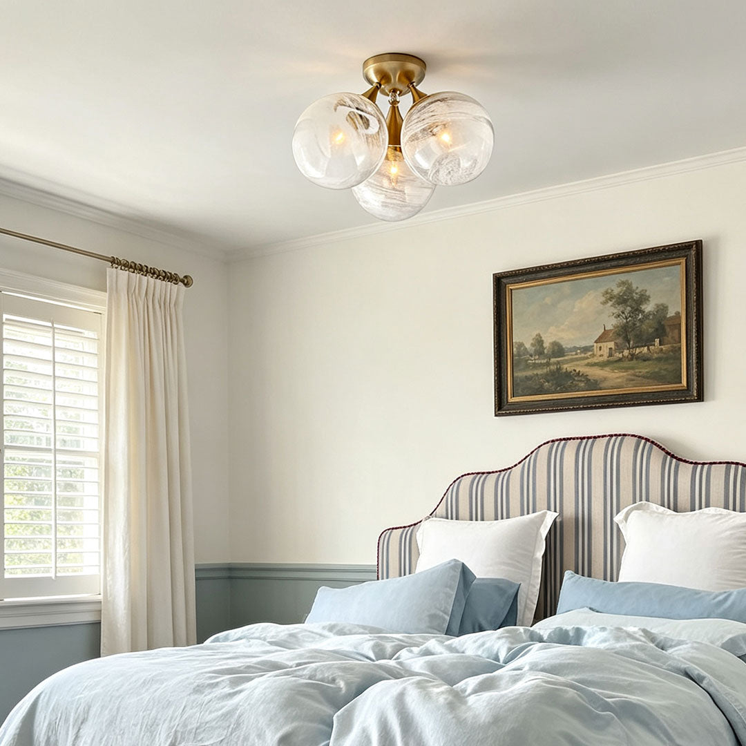 Contemporary flush mount light fixtures mounted in a cozy bedroom with soft warm illumination.