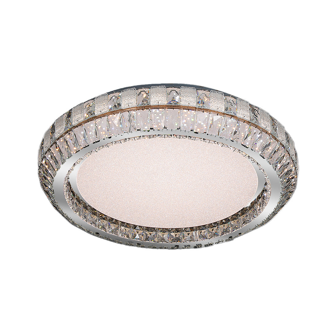 Contemporary flush mount light featuring a round design with crystal details and a metallic finish.