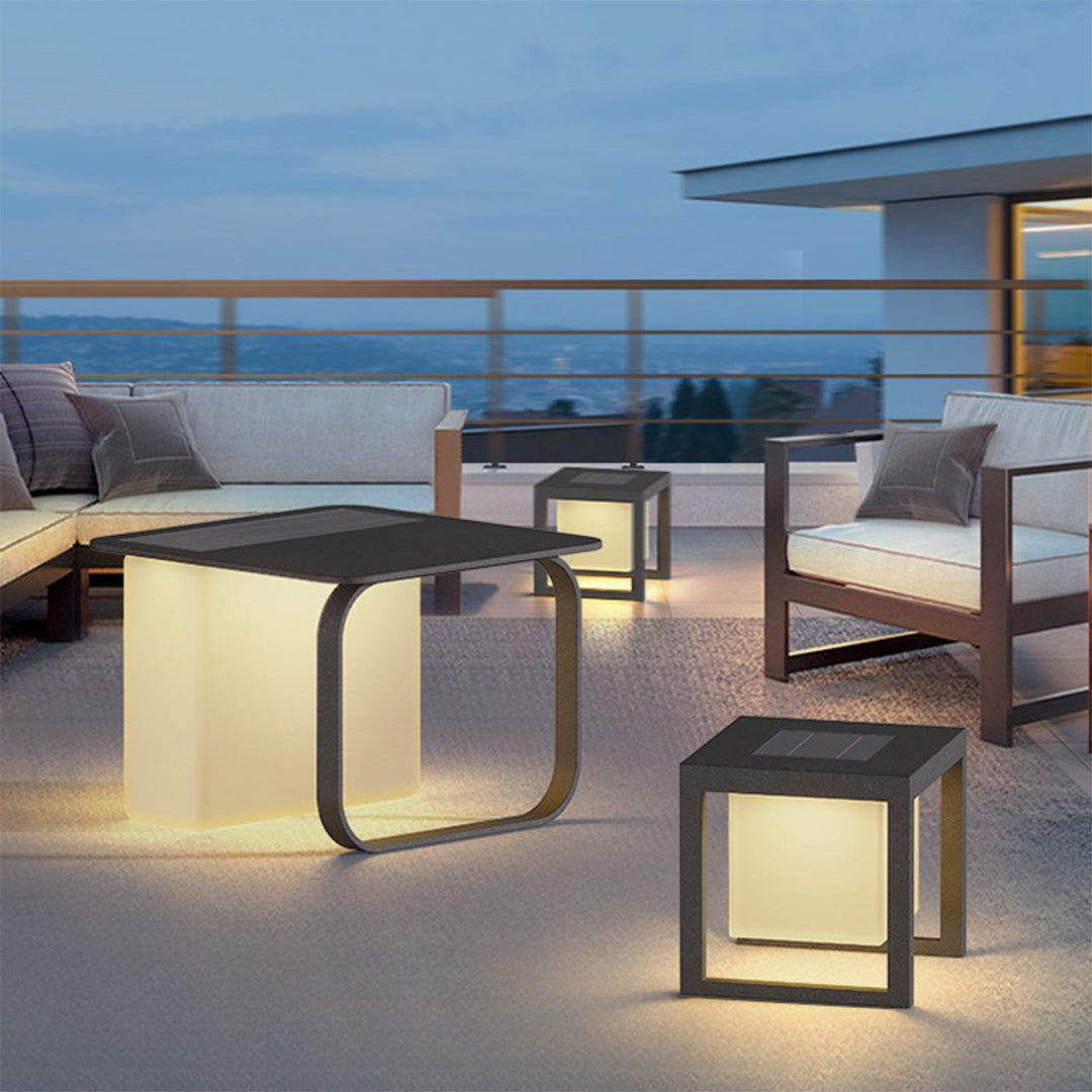 Contemporary outdoor lighting setup with geometric forms, handheld light elements for modern patio design