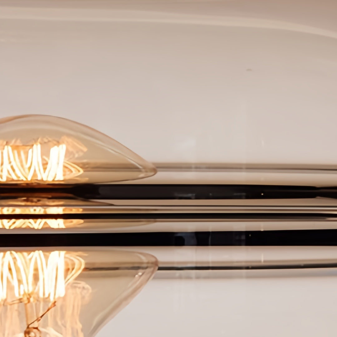 Contemporary glass small table lamp with warm glow illuminating stylish living space with wooden furniture