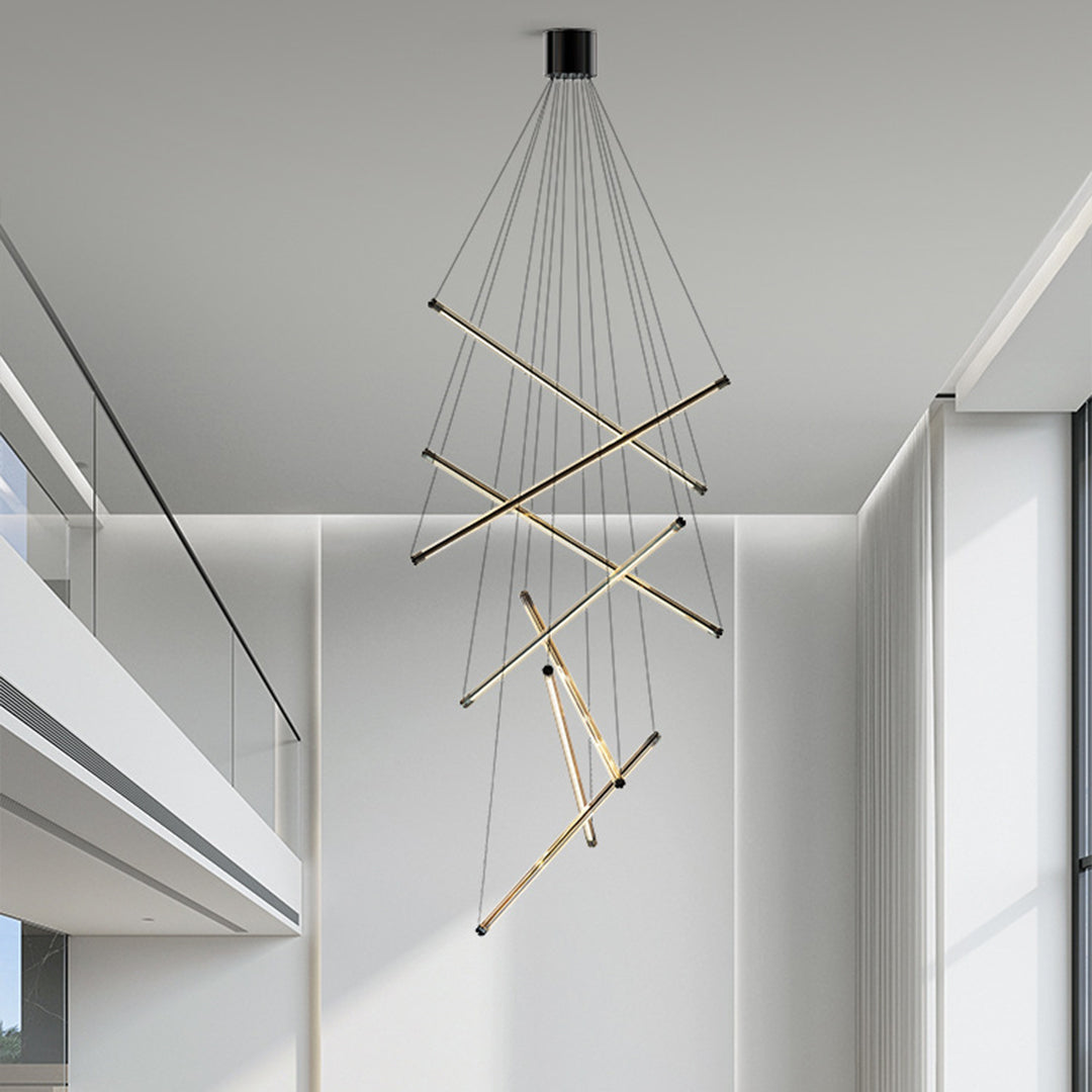 Contemporary LED linear chandelier with gold bars and cables, adding a touch of luxury to a white bedroom interior.
