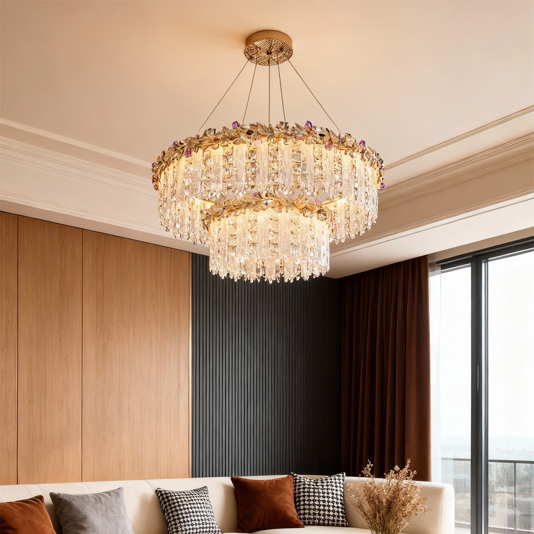Contemporary gold crystal chandelier complementing beige dining interior.