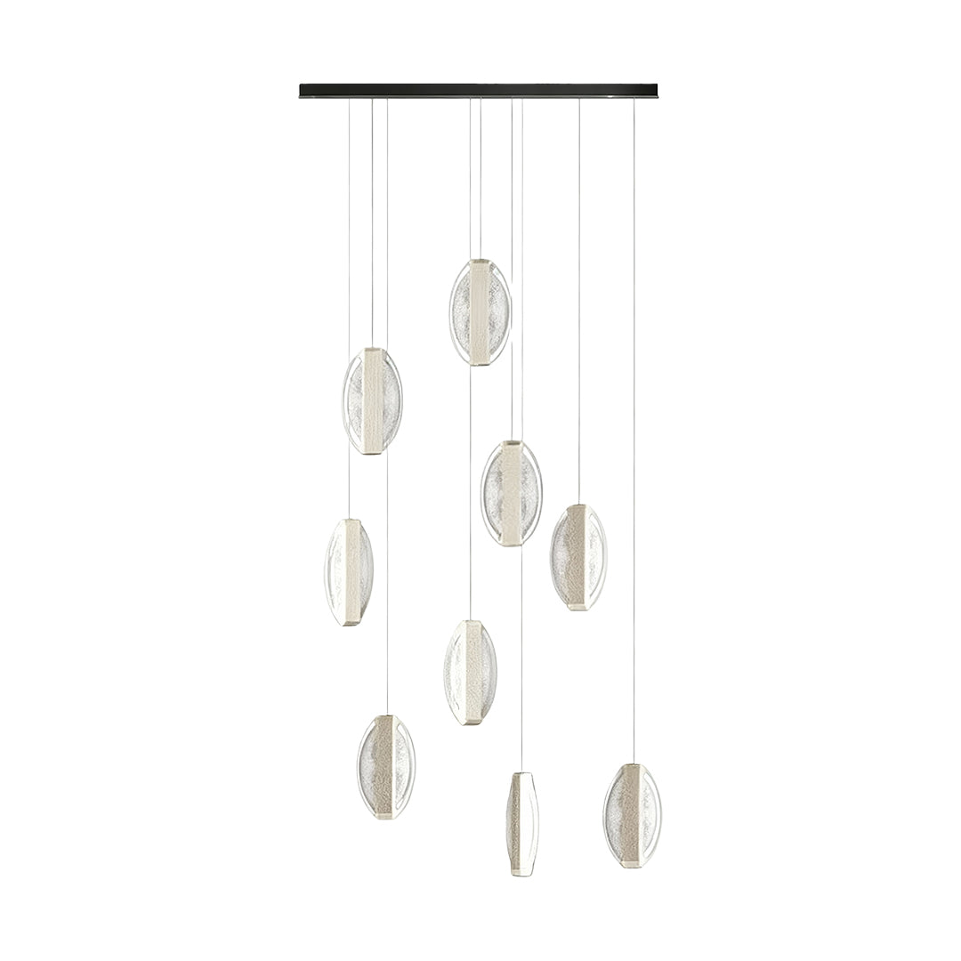 Contemporary gold modern chandelier featuring clustered arrangement of oval crystal pendants in cascading formation