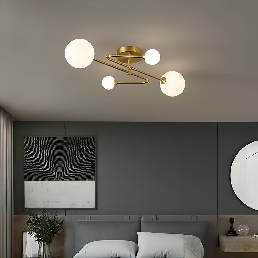 Contemporary gold semi flush mount light with branching structure illuminating modern dark interior