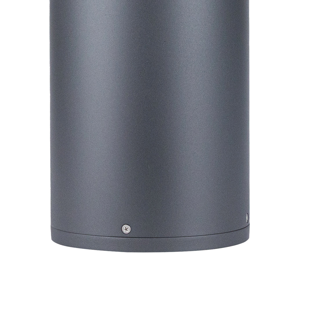 Contemporary gray bollard light with smooth finish designed for commercial outdoor applications