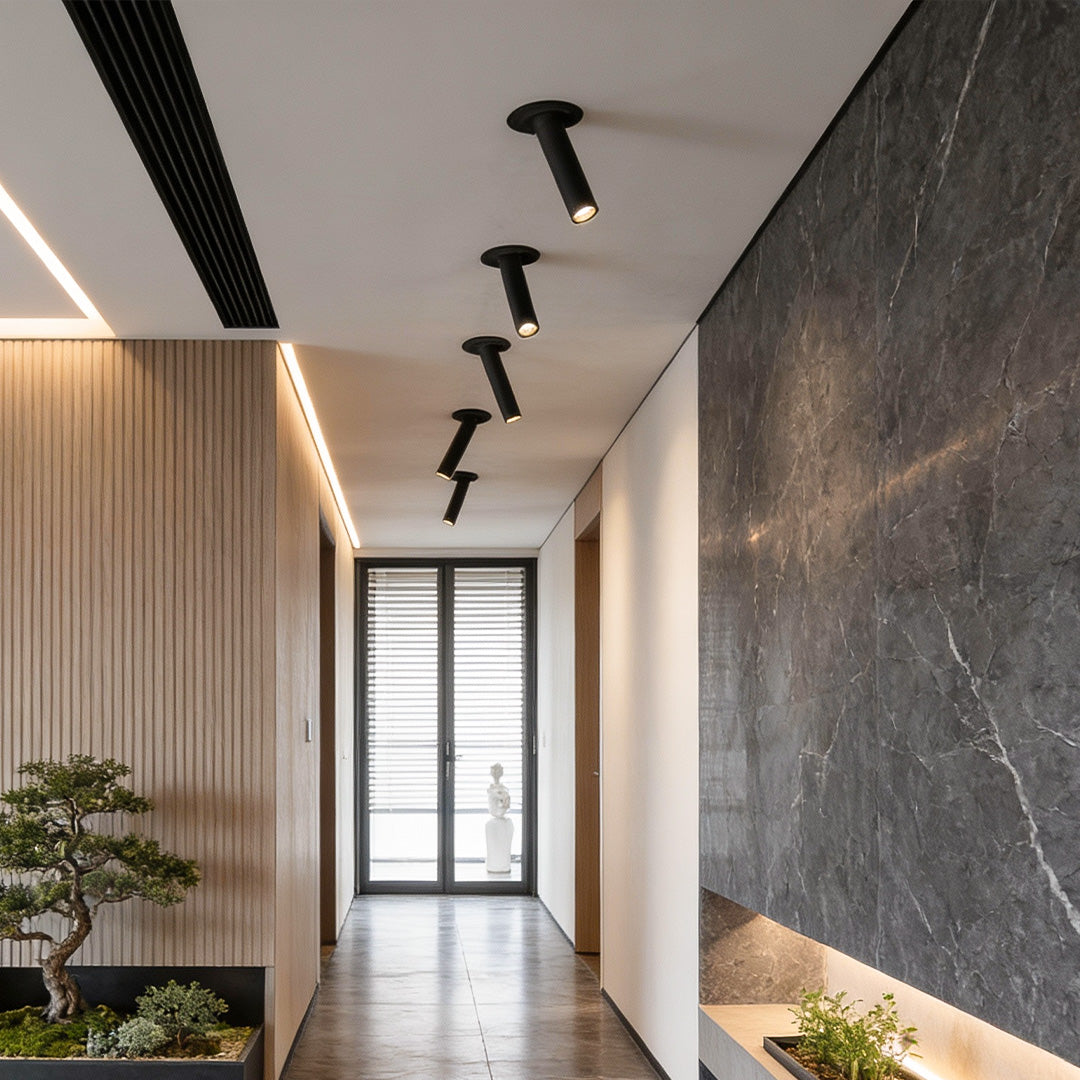 LED surface spotlights illuminating a contemporary hallway, providing directional light with minimalist design.
