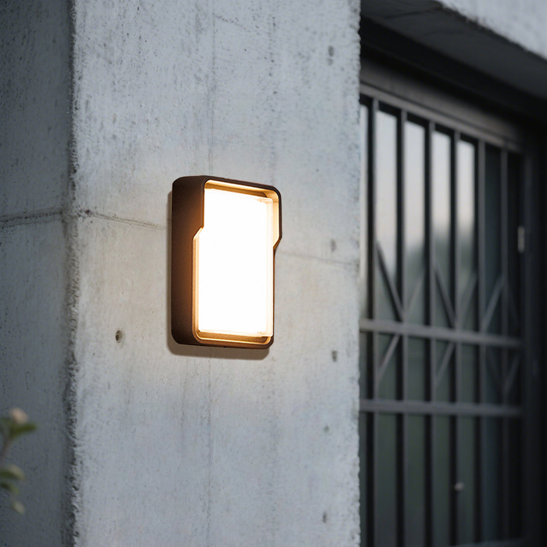Cylindrical white wall light with clean modern design for minimalist architectural applications
