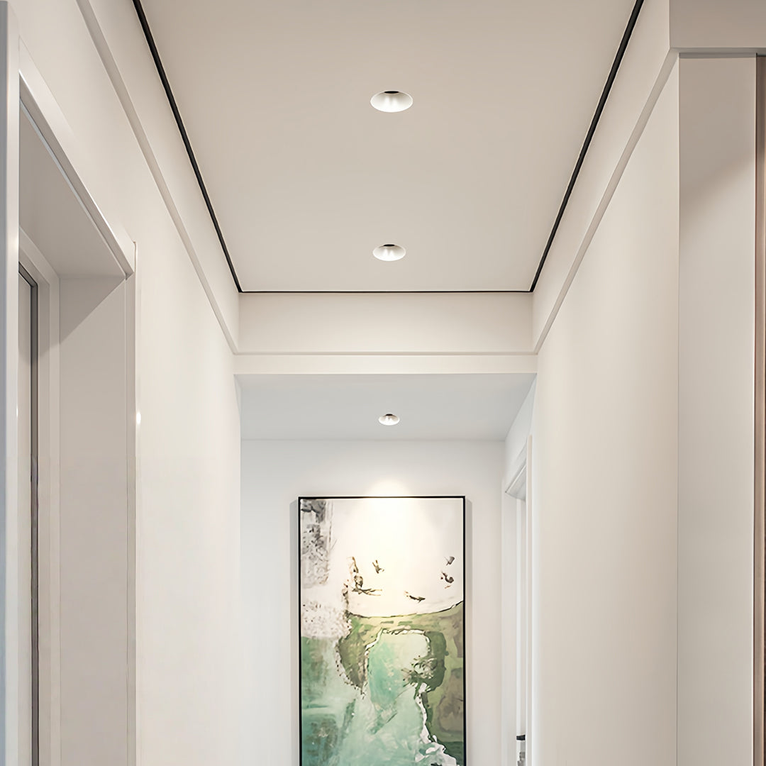 Contemporary indoor LED spotlight with glass shade chandelier styling creating serene atmosphere in minimalist hallway space.