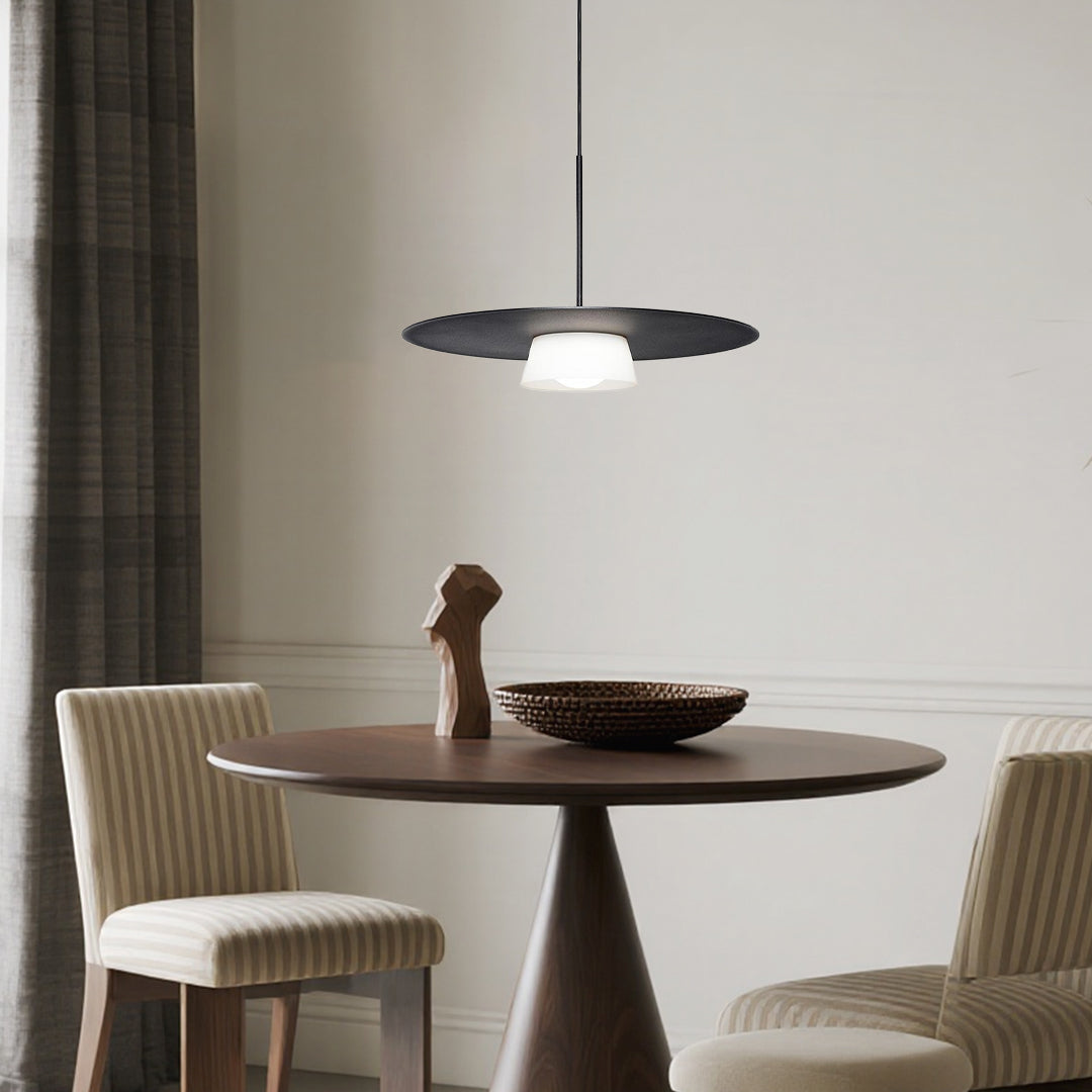 Contemporary island pendant light fixtures creating sophisticated ambiance above round dining table