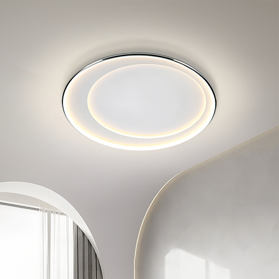 Contemporary LED round flush mount light installed in ceiling with bright even light distribution