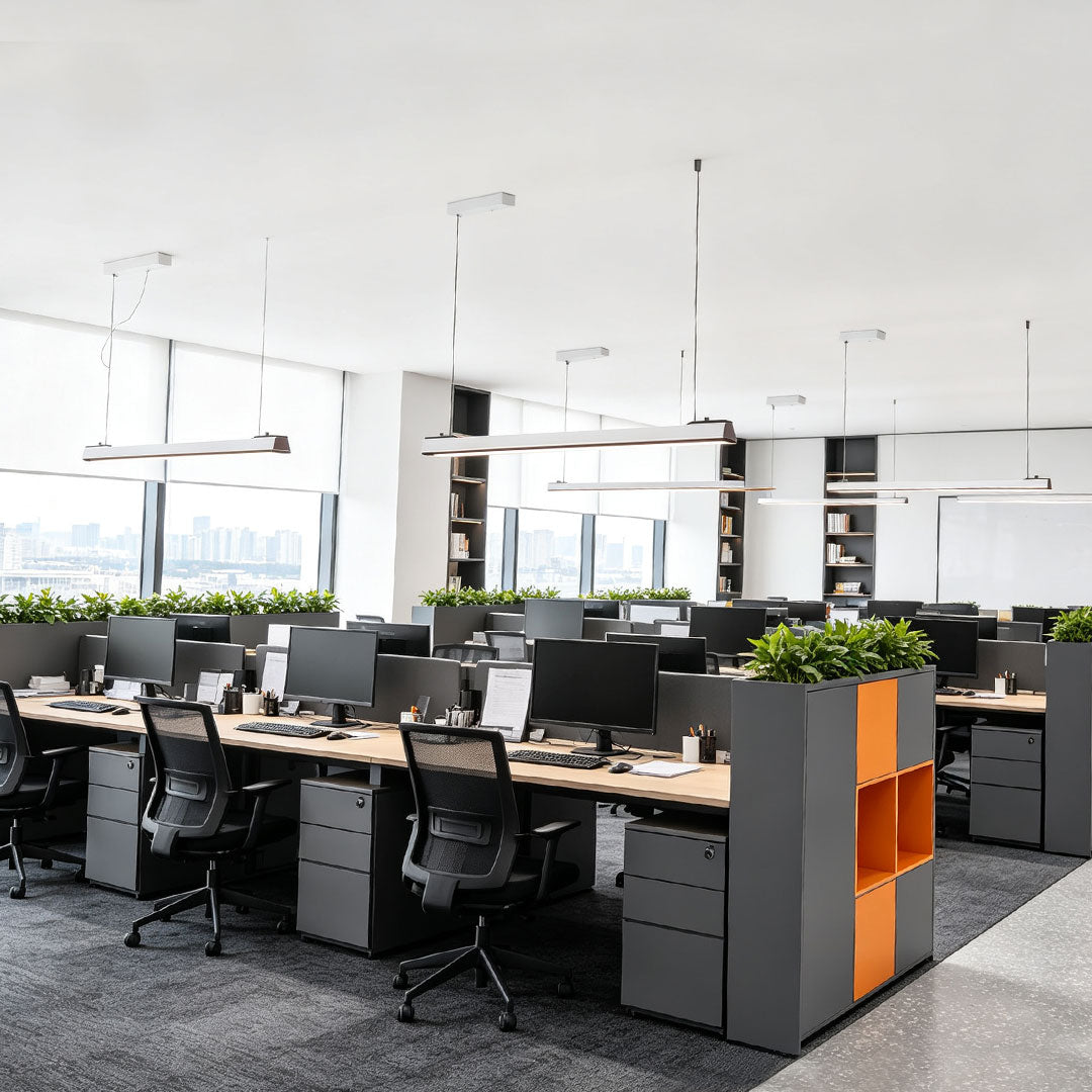 Contemporary LED linear suspension lighting illuminating a modern open office environment.