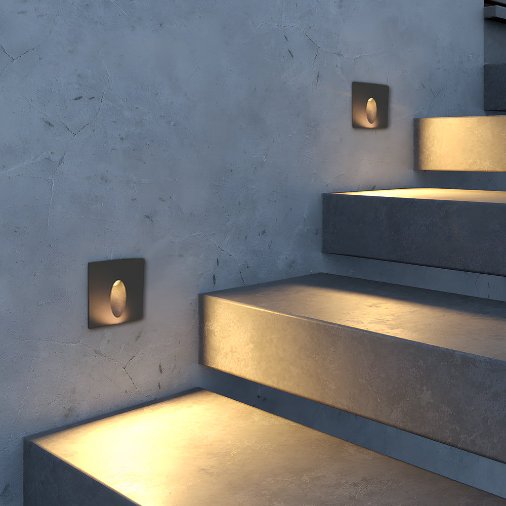 Contemporary LED step light installation providing safety lighting on blue painted stairway with clean minimalist design