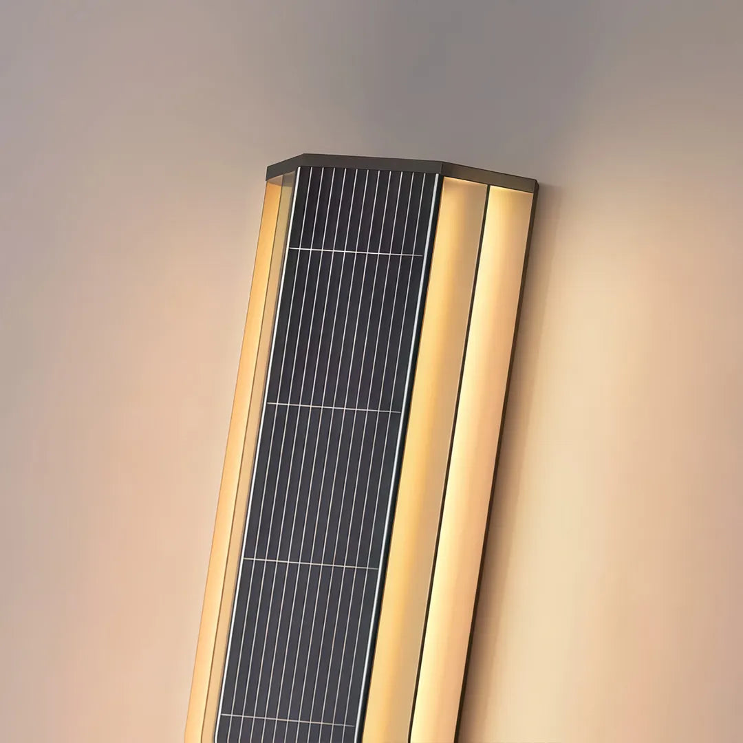 Angled close-up of a contemporary LED wall light with a perforated black center and integrated warm LED strips.