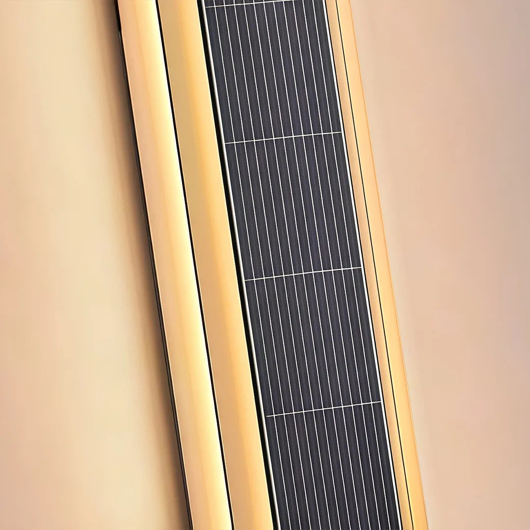 Close-up detail of a contemporary LED wall light showing the textured black center panel and warm illuminated sides.