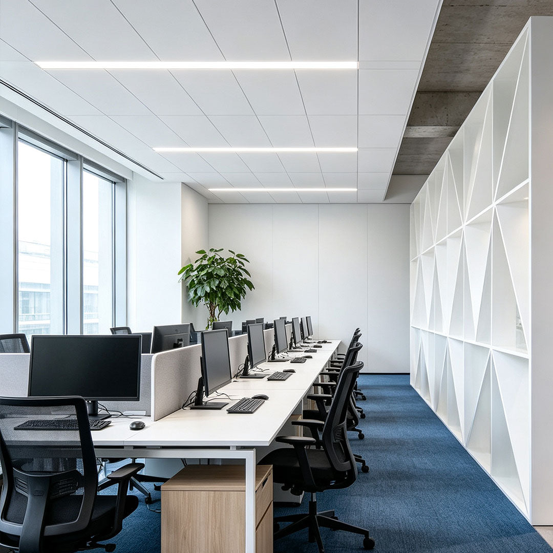 Contemporary linear ceiling light installed in a clean open-plan office environment.