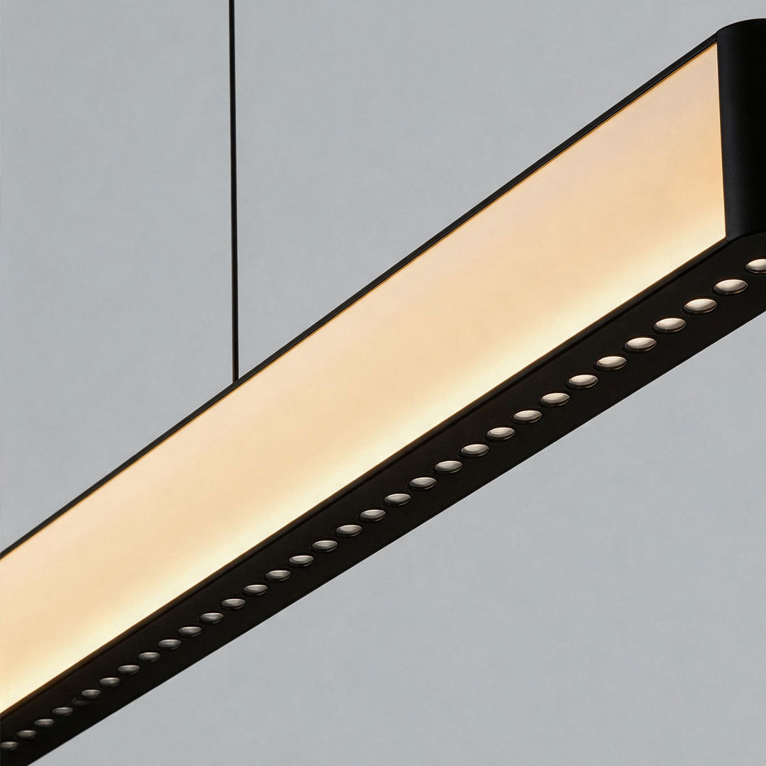 Close-up detail of contemporary linear chandelier with colorful gradient LED diffuser.
