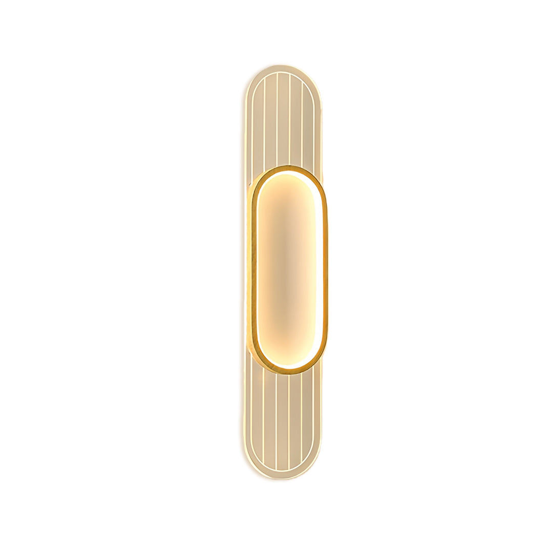 Contemporary linear led wall light with capsule-shaped frame in gold tone and decorative vertical grooves