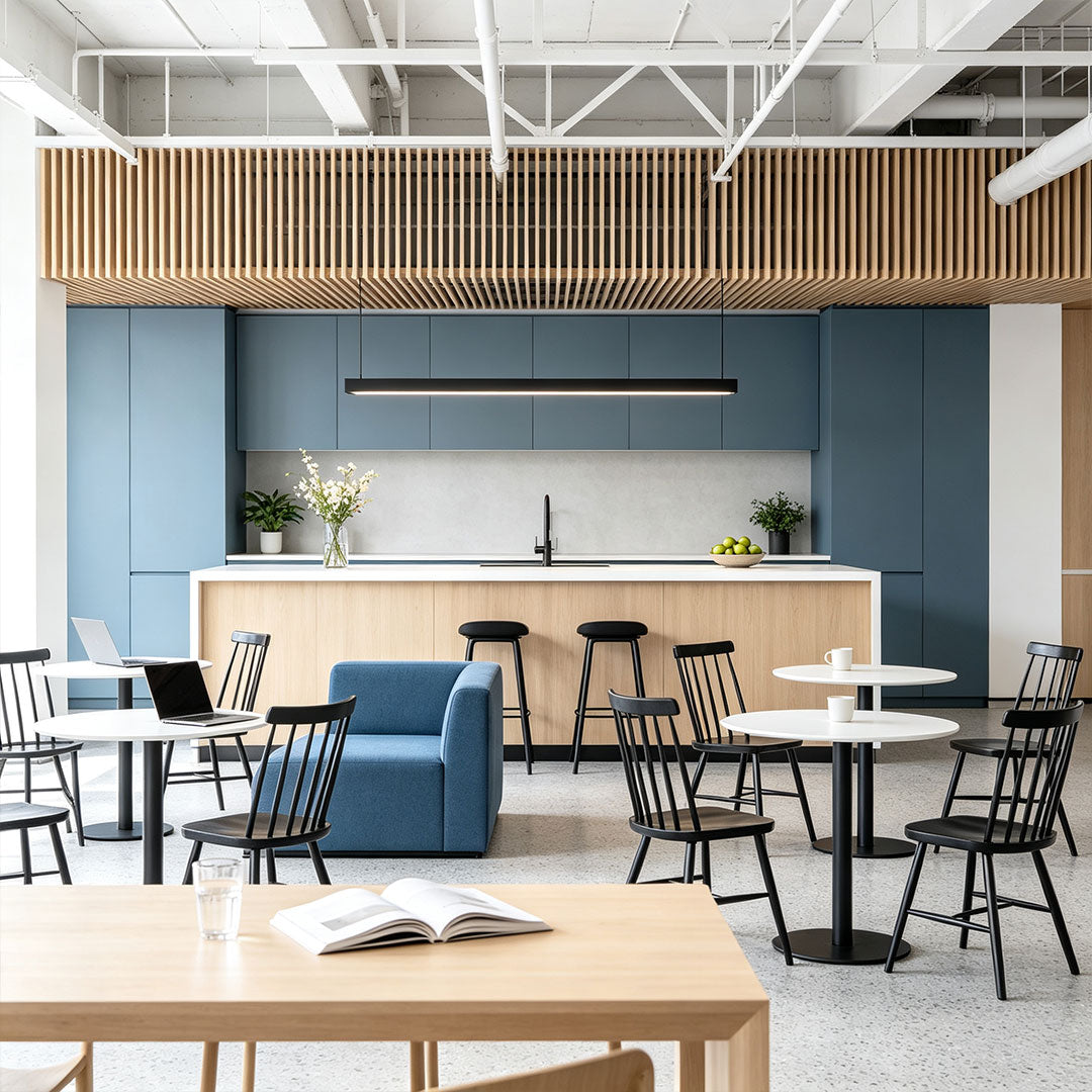 Contemporary linear suspension light enhancing a modern café and lounge area.
