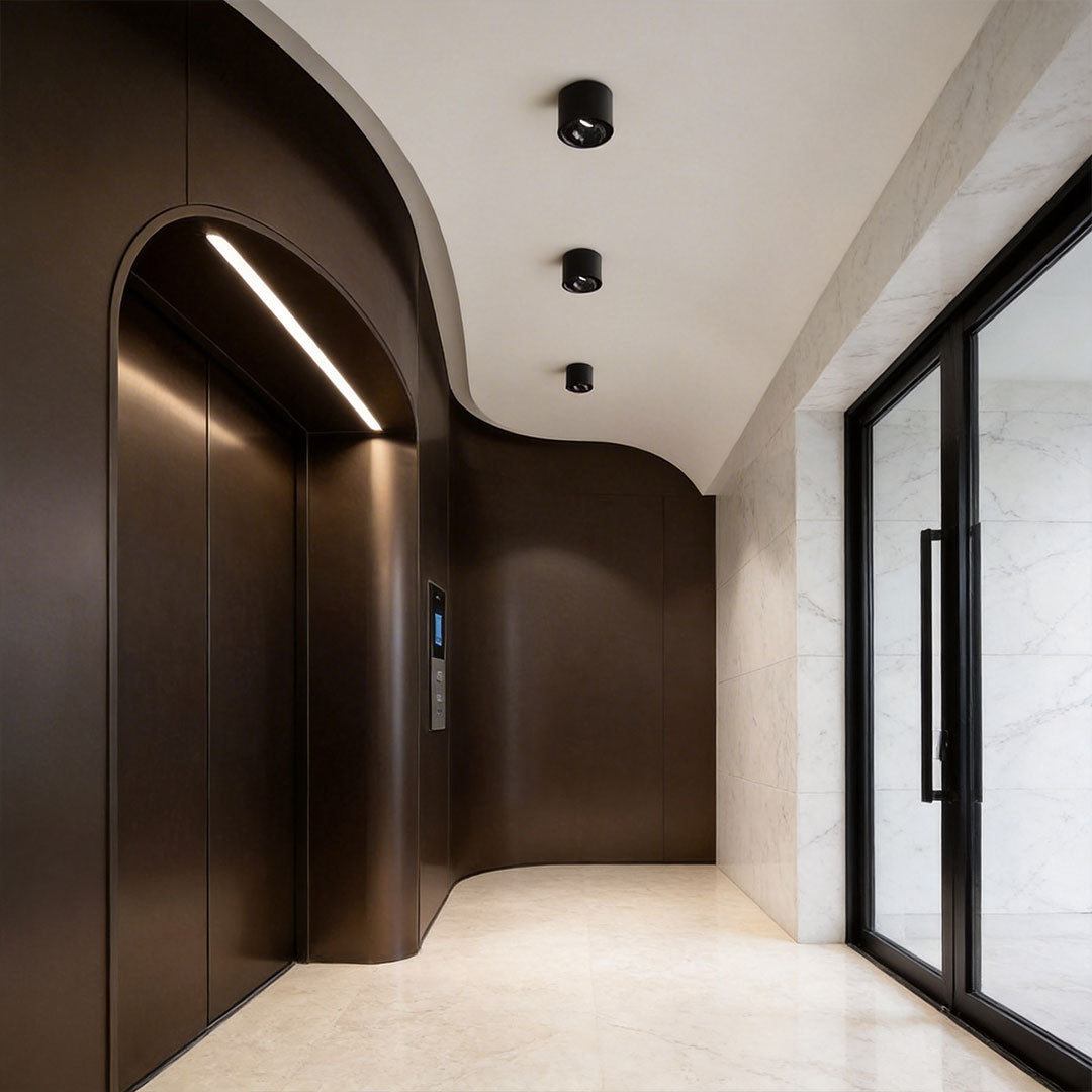 Contemporary living room featuring ceiling spotlights enhancing the decor.
