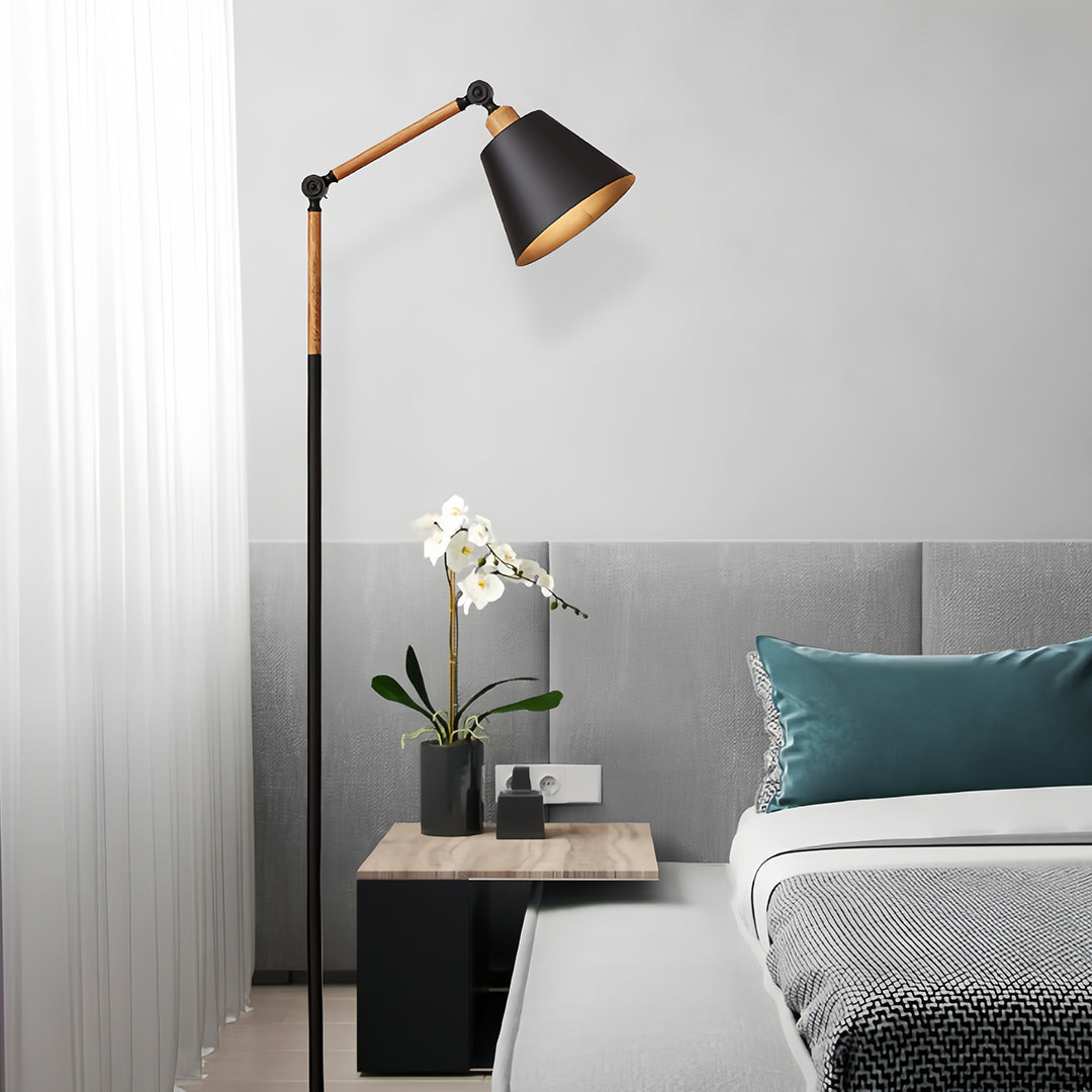 Contemporary metallic floor lamp with marble base and adjustable brass arm for sophisticated task lighting