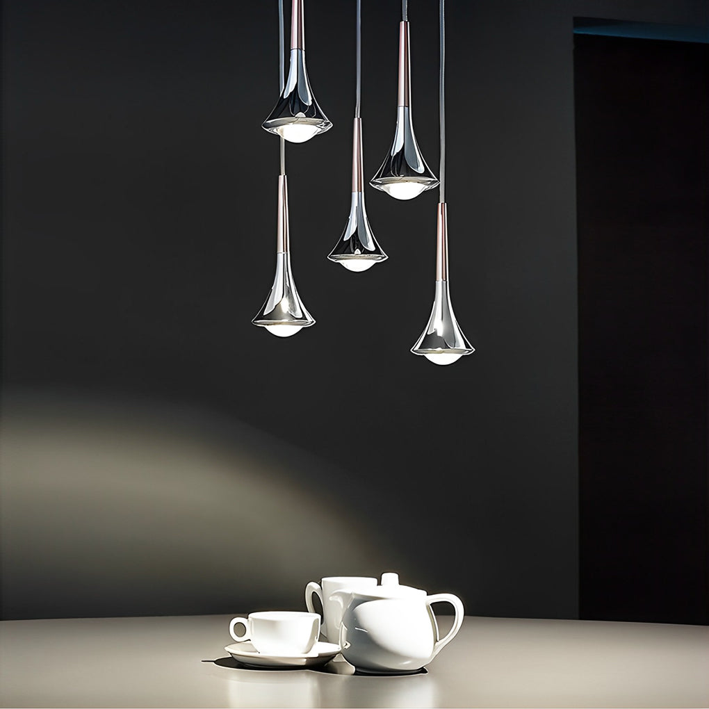 Contemporary mini pendant lights grouped above a tea set, providing soft accent lighting in a modern interior.