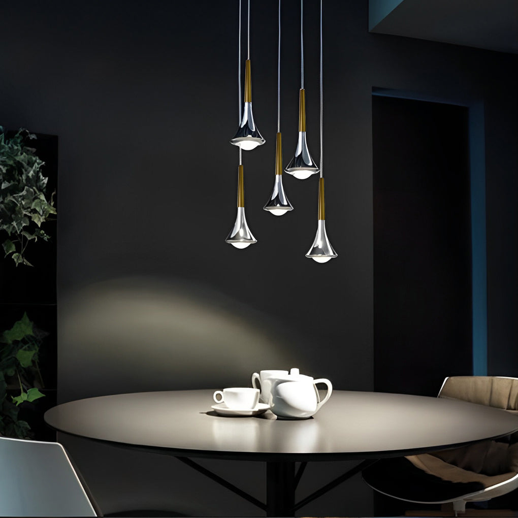 Contemporary mini pendant lights illuminating a round table, creating an intimate and modern dining atmosphere.