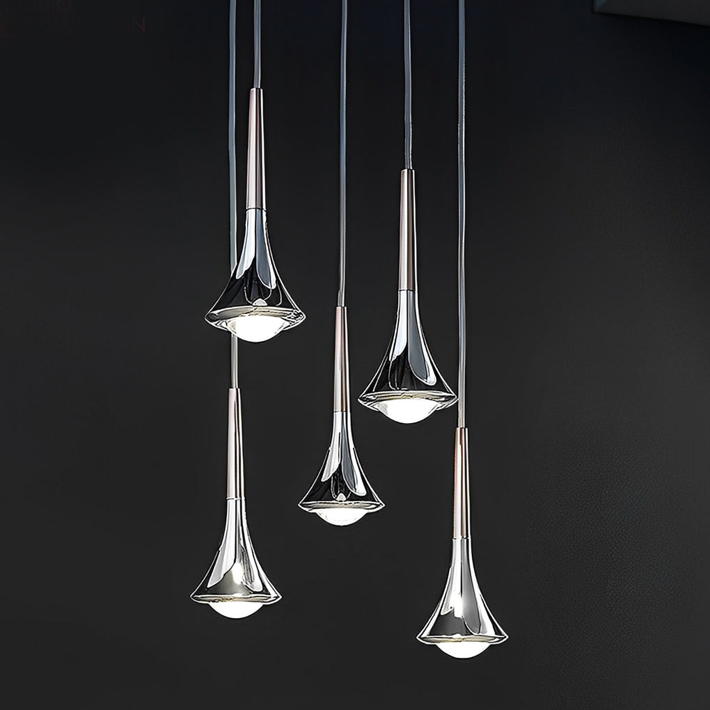 Contemporary mini pendant lights displayed in a vertical cluster, emphasizing polished metal finish and refined glow.