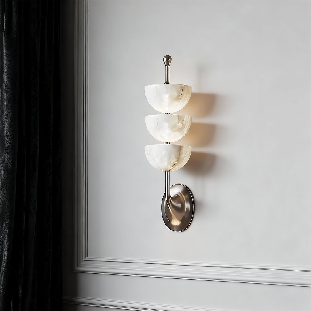 Contemporary modern LED wall lights with glass shade chandelier design creating sculptural accent in modern white minimalist hallway.