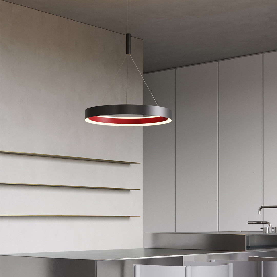 Contemporary modern ring chandelier with glass shade chandelier design illuminating minimalist white kitchen and stairway space.