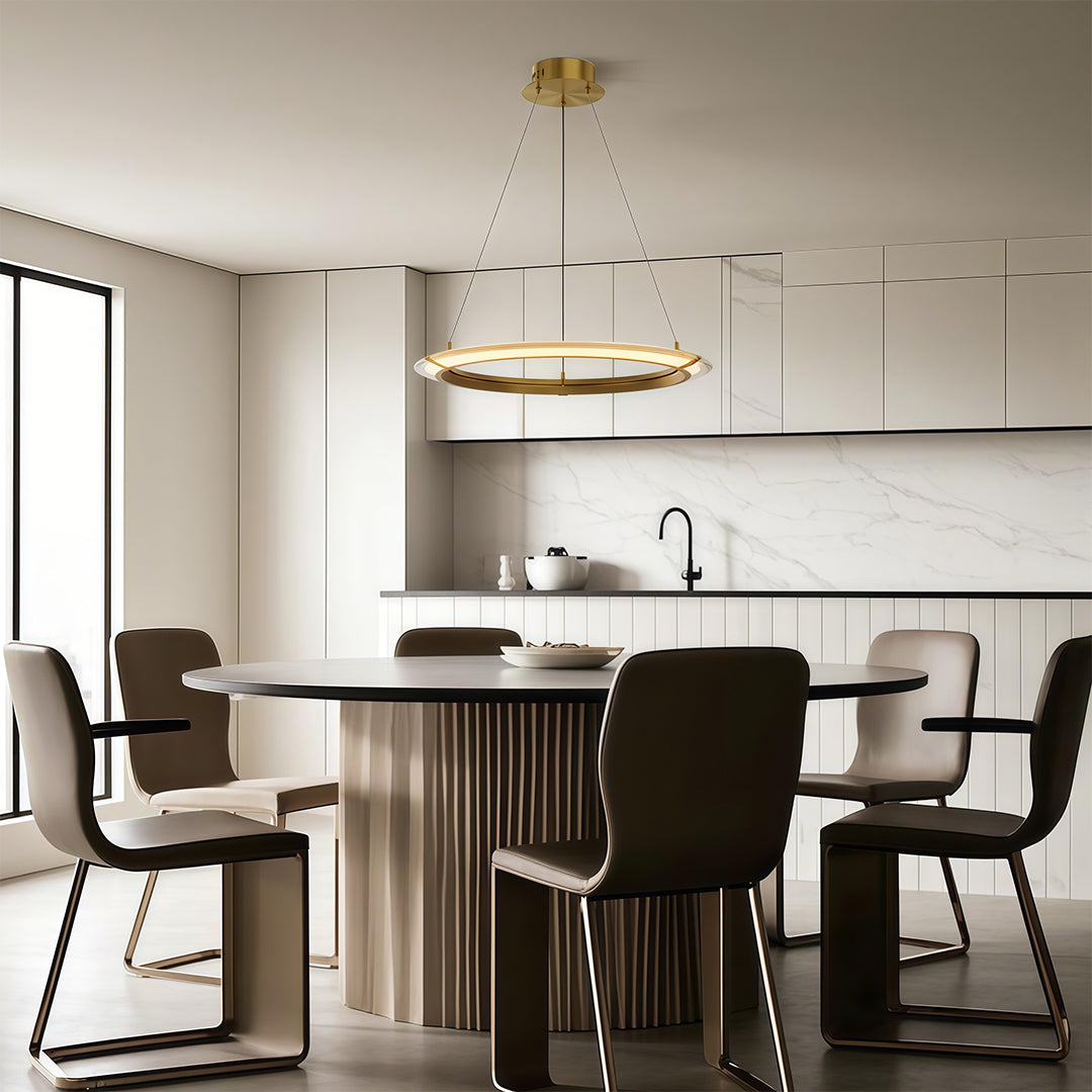 Contemporary modern round chandelier with dual circular rings, suspended above a dining table.