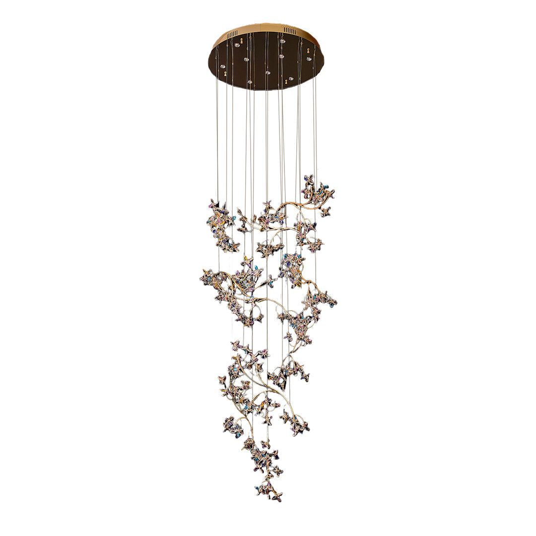 Contemporary modern staircase chandelier with glass shade chandelier aesthetic in dramatic vertical form with organic crystal branch design.