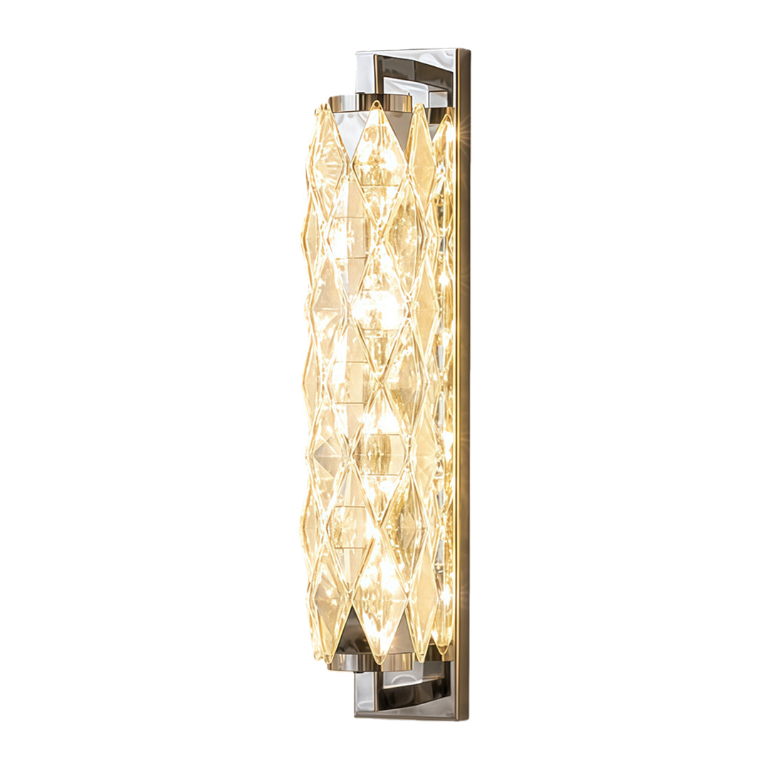 Contemporary modern wall light featuring elongated crystal shade with chrome mounting hardware.
