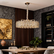 Contemporary nordic chandelier featuring glass shade chandelier design providing warm ambient lighting in sophisticated dark interior.