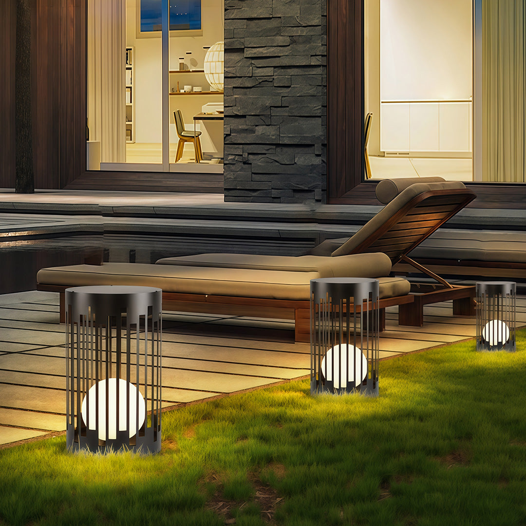 Contemporary outdoor lantern light with glass shade chandelier aesthetic providing decorative lighting along modern entrance pathway.