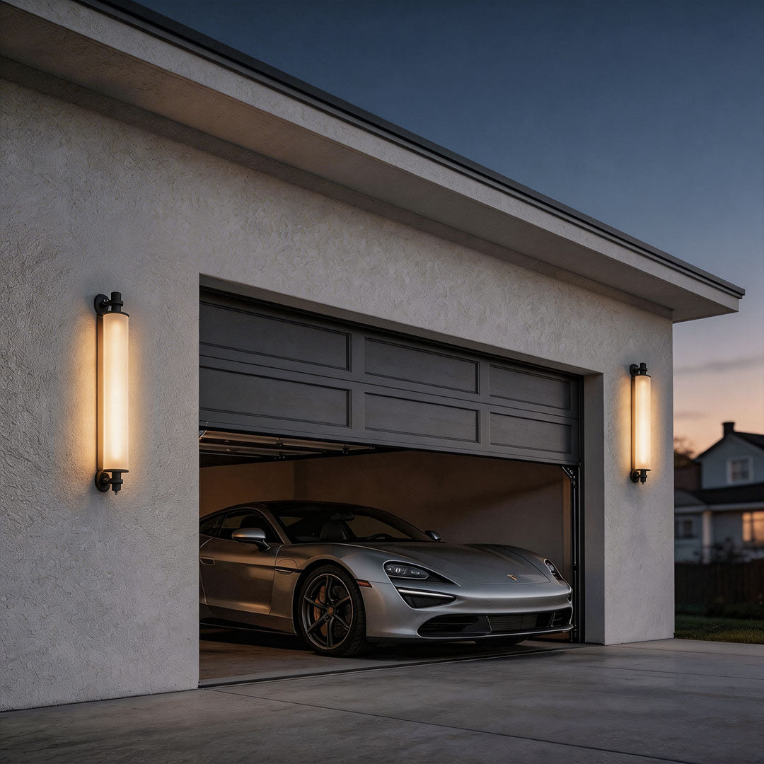Contemporary outdoor LED wall lights with a sleek design, mounted near a garage door.