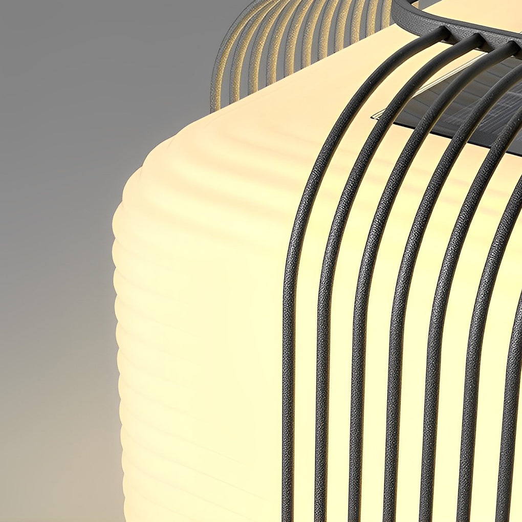 Contemporary outdoor pillar lights with a close-up of their layered curved design.