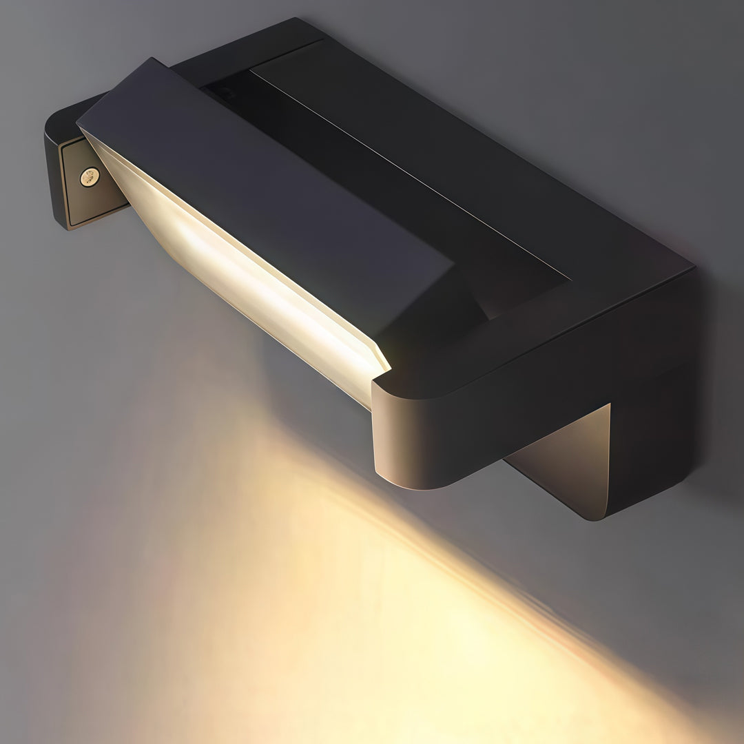 Close-up of contemporary outdoor wall light showing slim LED diffuser and black metal housing.