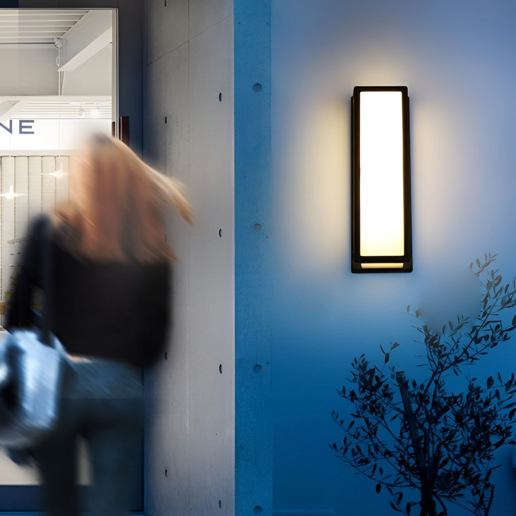 Contemporary outdoor wall light along exterior walkway